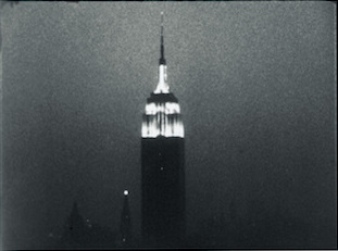 Screenshot from the film "Empire" (1965), directed by Andy Warhol, cinematography by Jonas Mekas